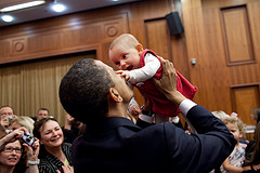 President Obama demonstrates the neat little box around him that keeps this baby safe from third-hand smoke